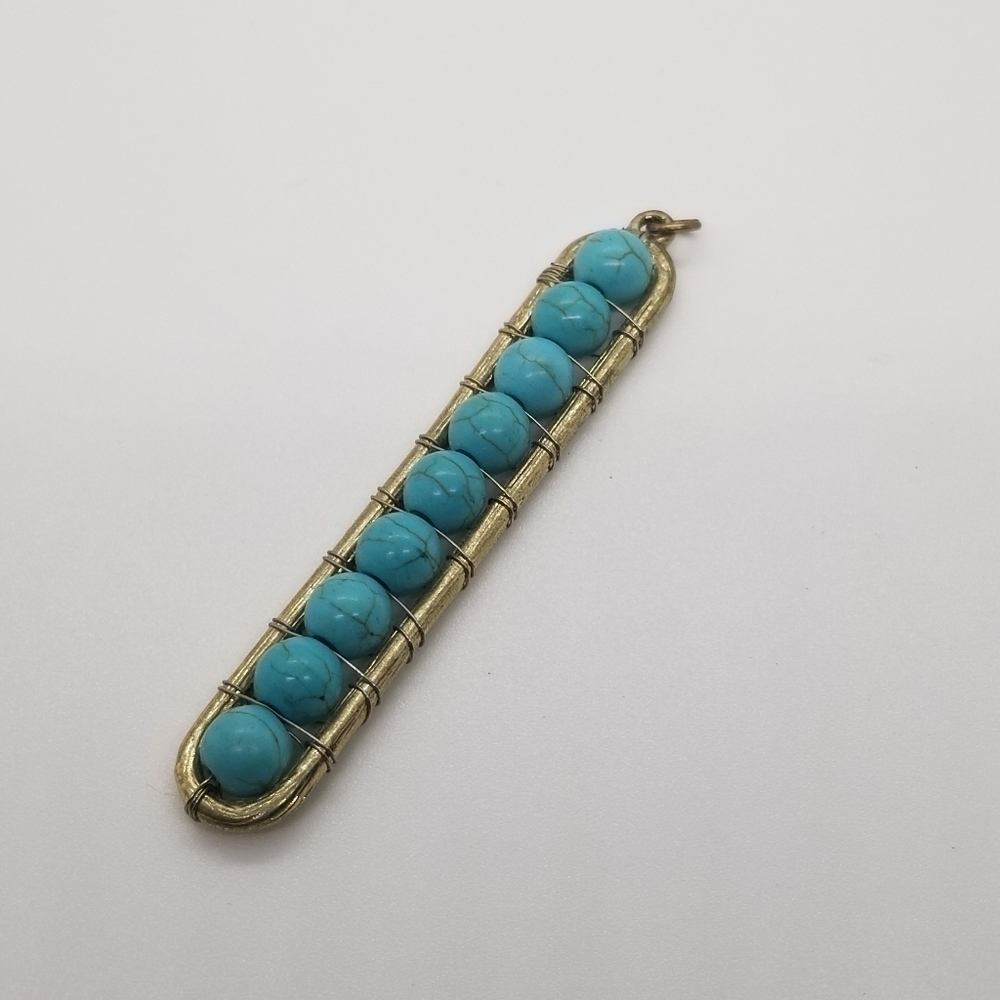 long gold tone faux turquoise beaded pendant